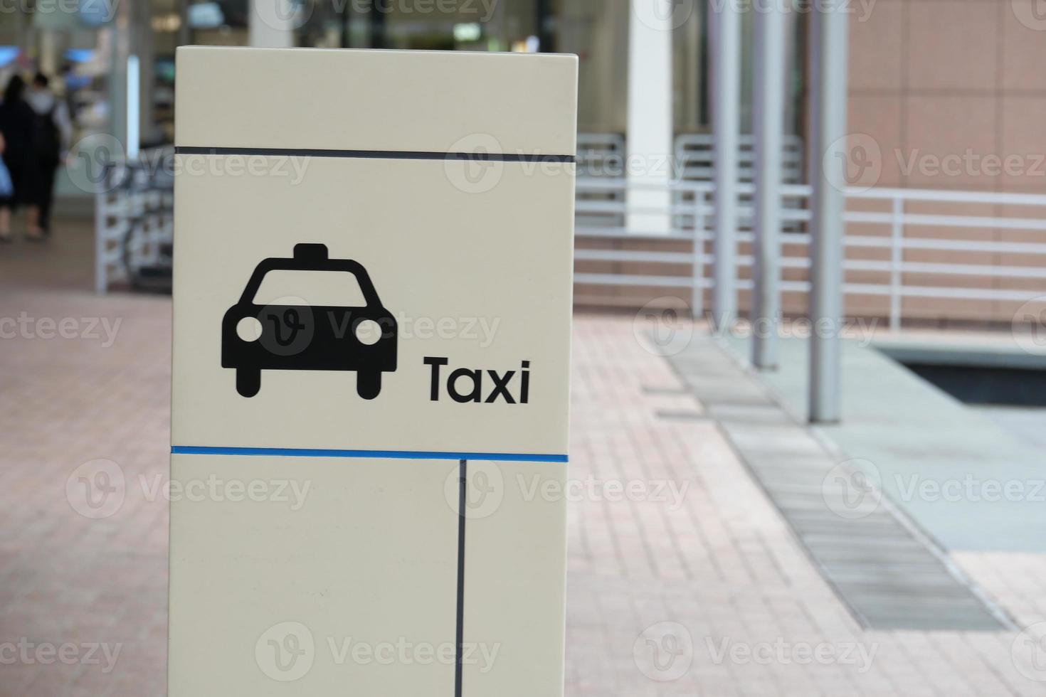 taxi stand sign on black in singapore photo