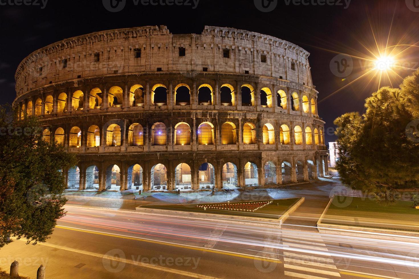 rome, italy, colosseum old ancient building gladiator battle at night. photo