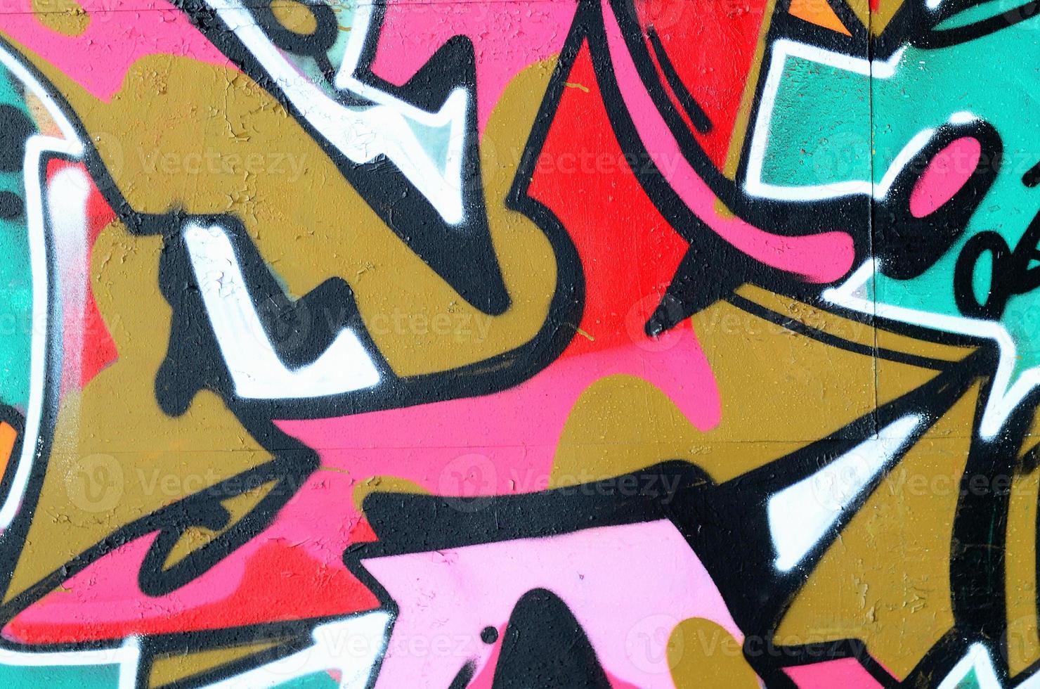 fragmento de un hermoso patrón de graffiti en rosa y verde con un contorno negro. imagen de fondo de arte callejero foto