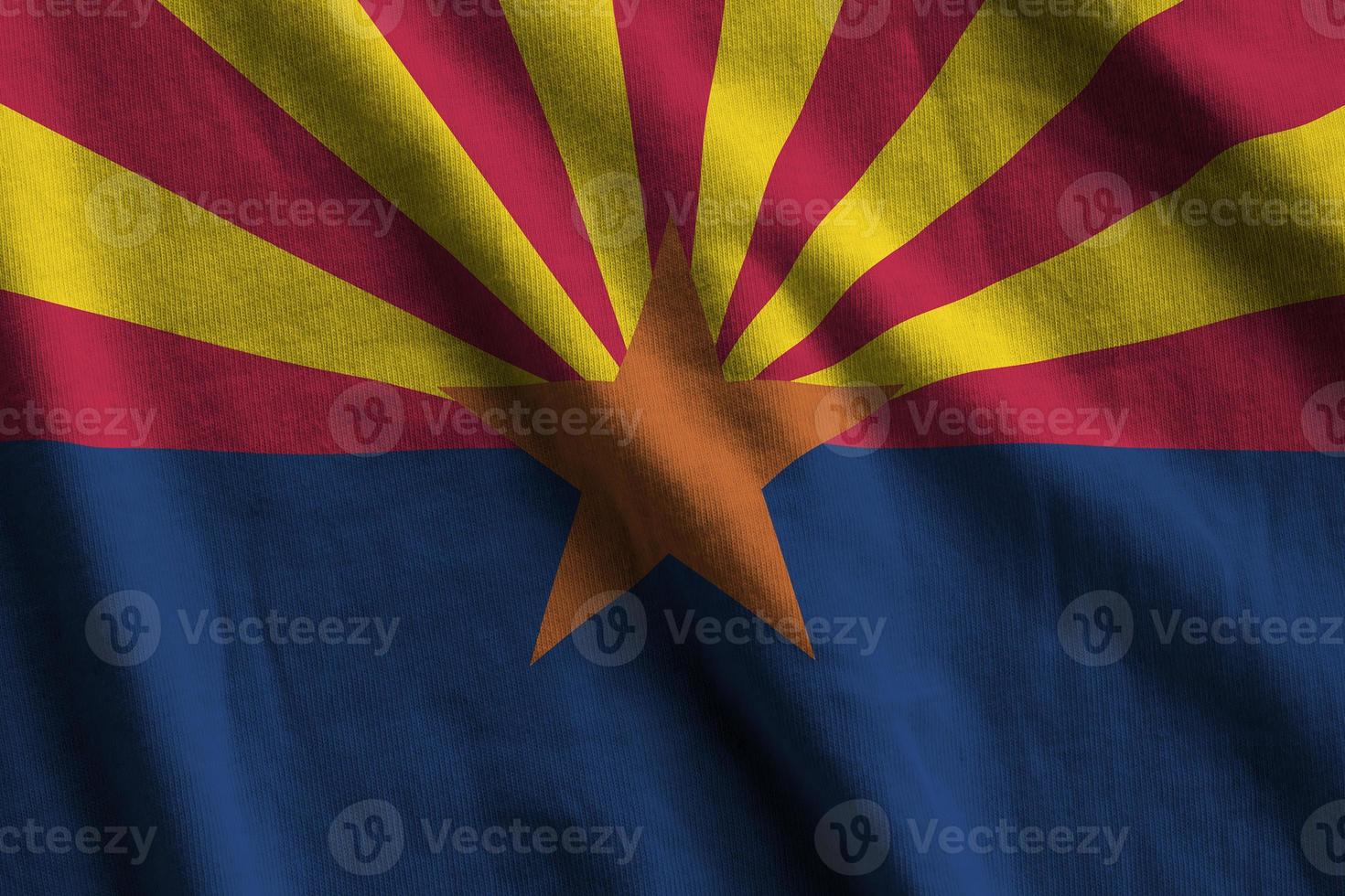 Arizona US state flag with big folds waving close up under the studio light indoors. The official symbols and colors in banner photo