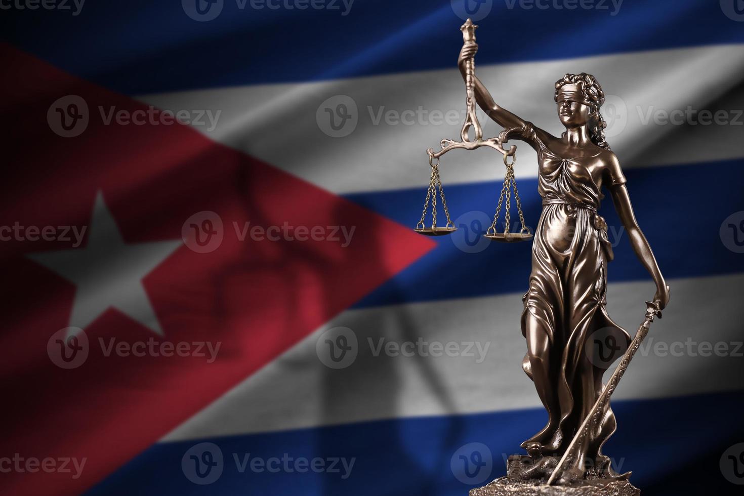 Cuba flag with statue of lady justice and judicial scales in dark room. Concept of judgement and punishment photo