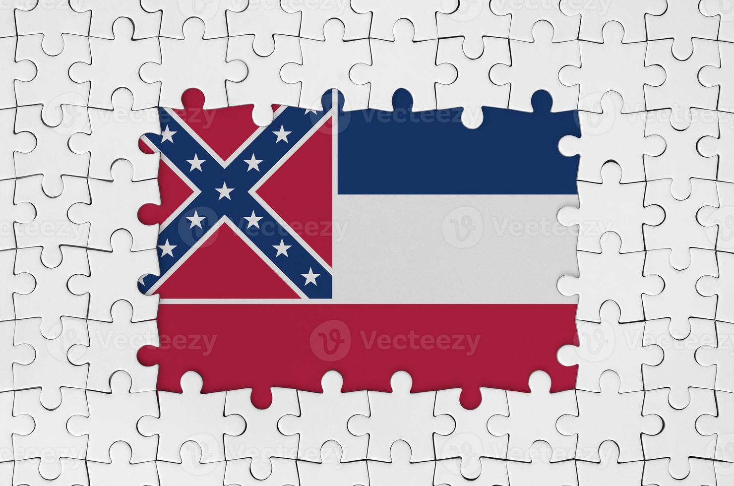 Mississippi new US state flag in frame of white puzzle pieces with missing central part photo