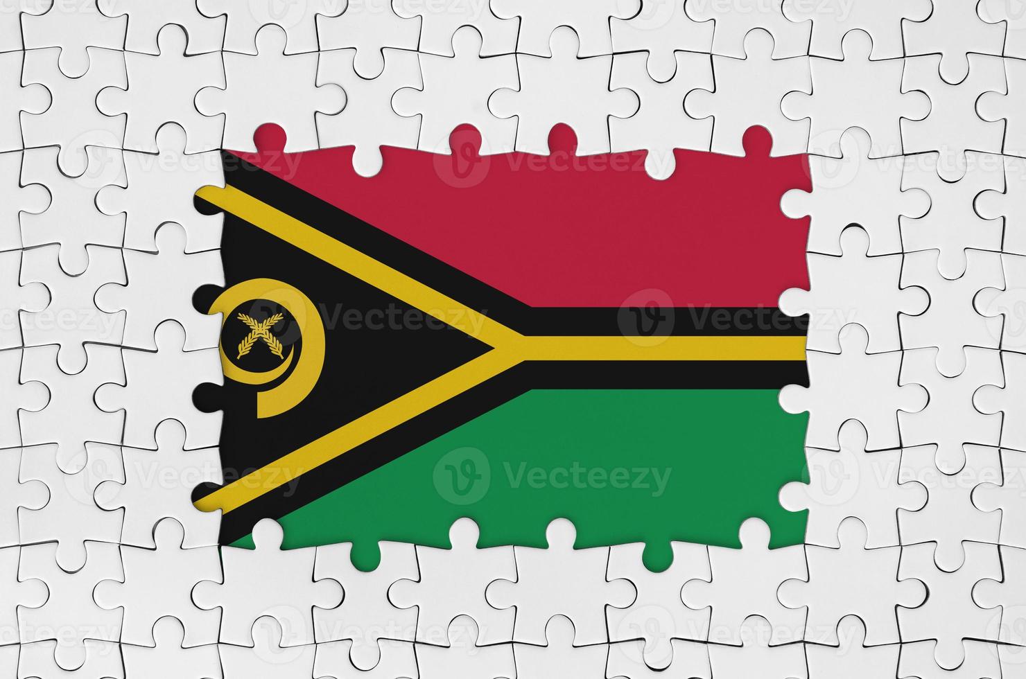 Vanuatu flag in frame of white puzzle pieces with missing central part photo