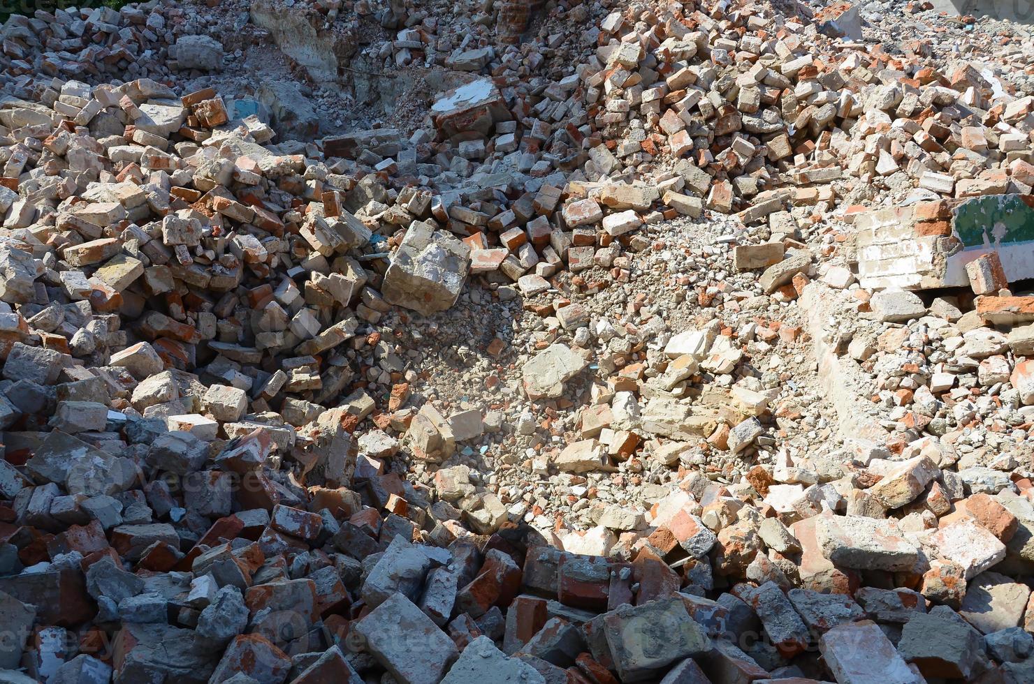 Pile of bricks and fragments of concrete from destroyed building photo