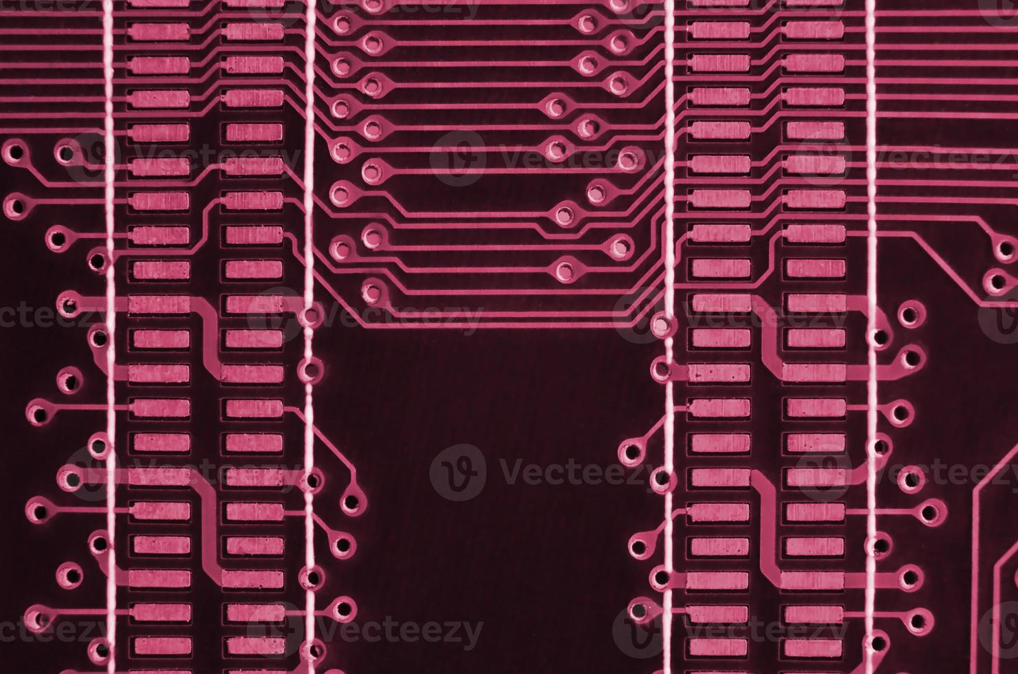 Close up of ed micro circuit board. Abstract technology background. Image toned in Viva Magenta, color of the 2023 year photo