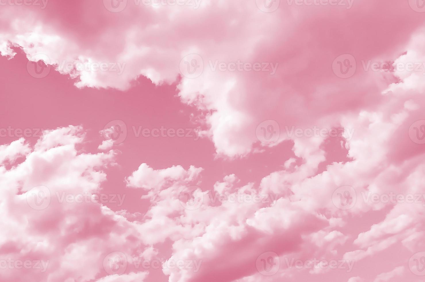 A blue sky with lots of white clouds of different sizes Image toned in Viva Magenta, color of the year photo