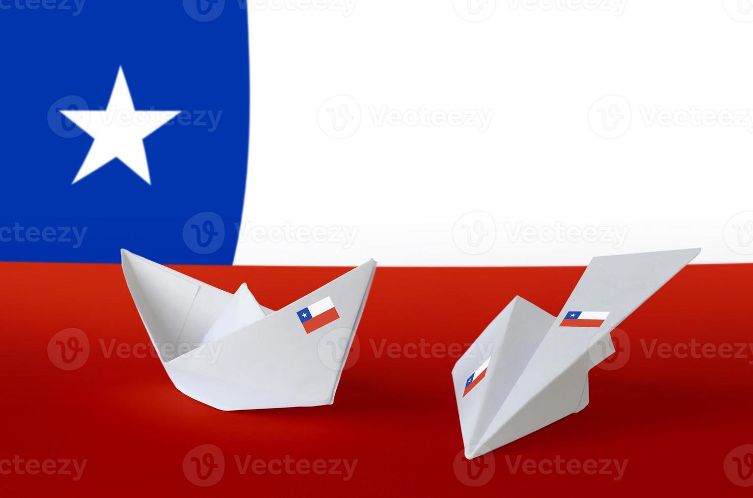 Chile flag depicted on paper origami airplane and boat. Handmade arts concept photo