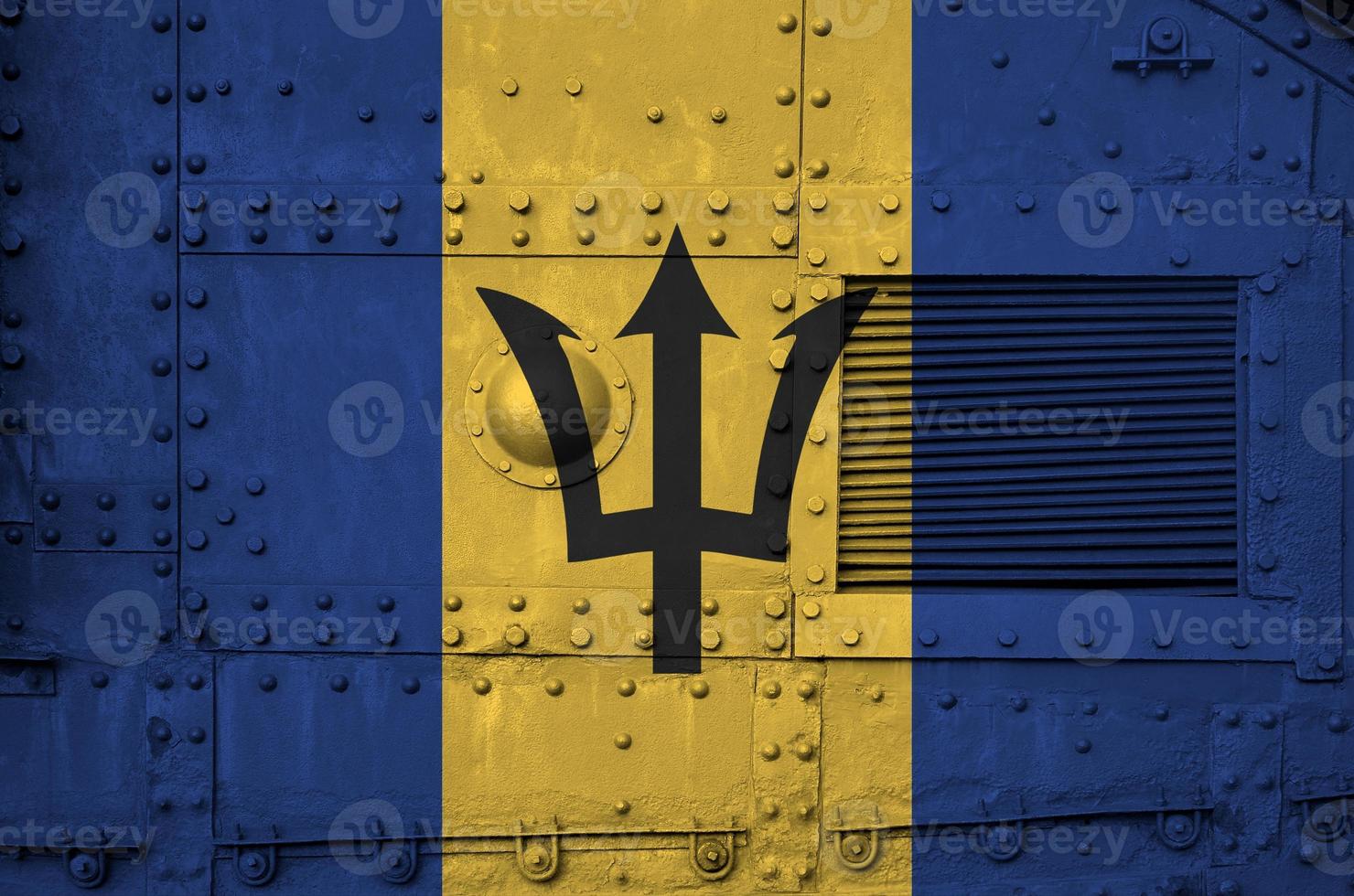 Barbados flag depicted on side part of military armored tank closeup. Army forces conceptual background photo