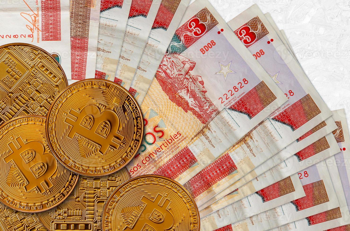 3 cuban pesos convertibles bills and golden bitcoins. Cryptocurrency investment concept. Crypto mining or trading photo