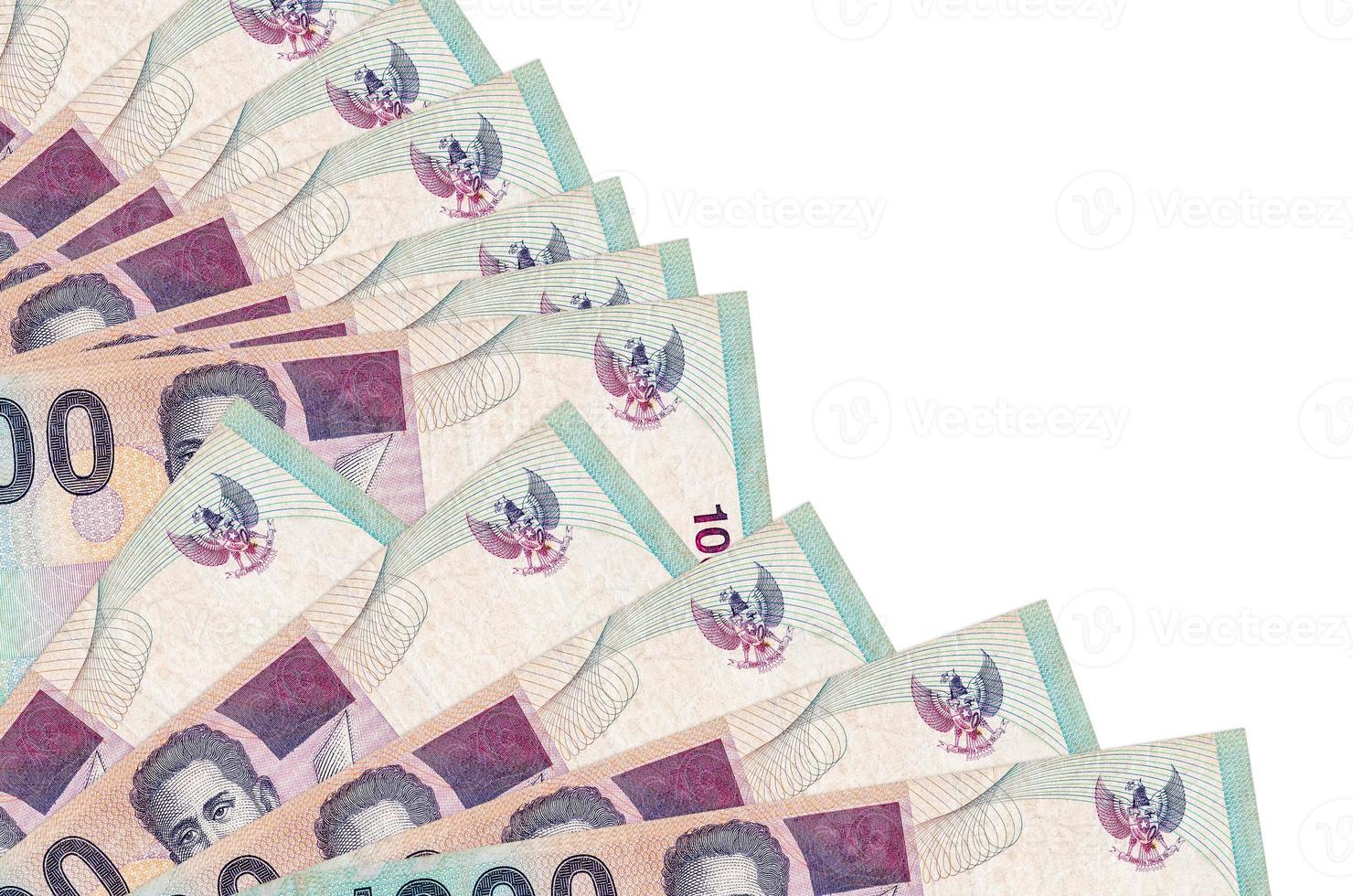1000 Indonesian rupiah bills lies isolated on white background with copy space stacked in fan close up photo