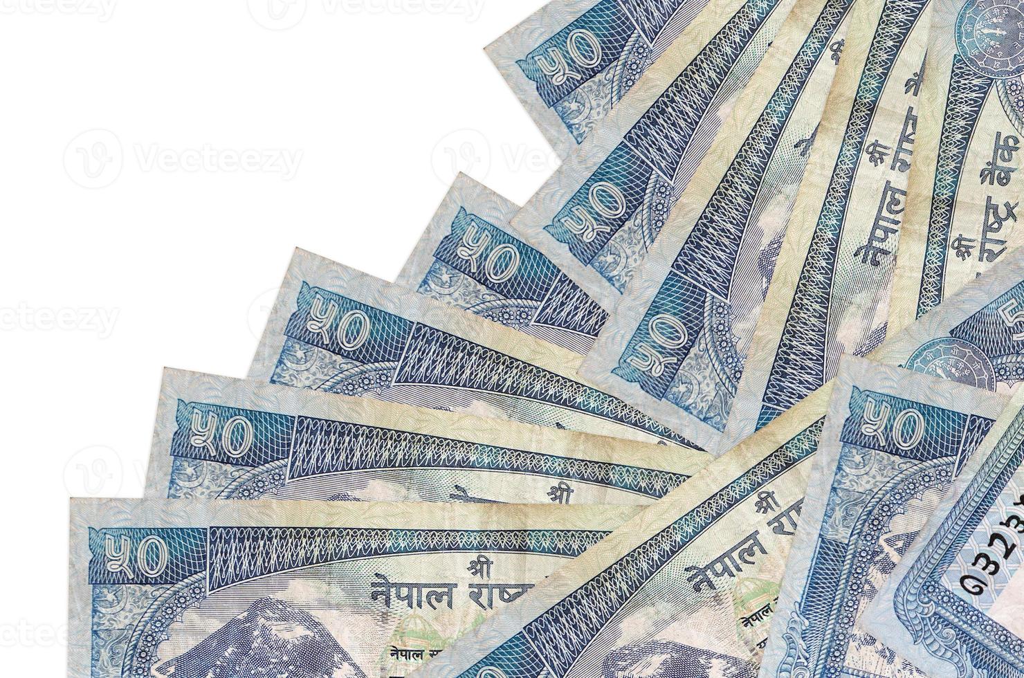 50 Nepalese rupees bills lies in different order isolated on white. Local banking or money making concept photo