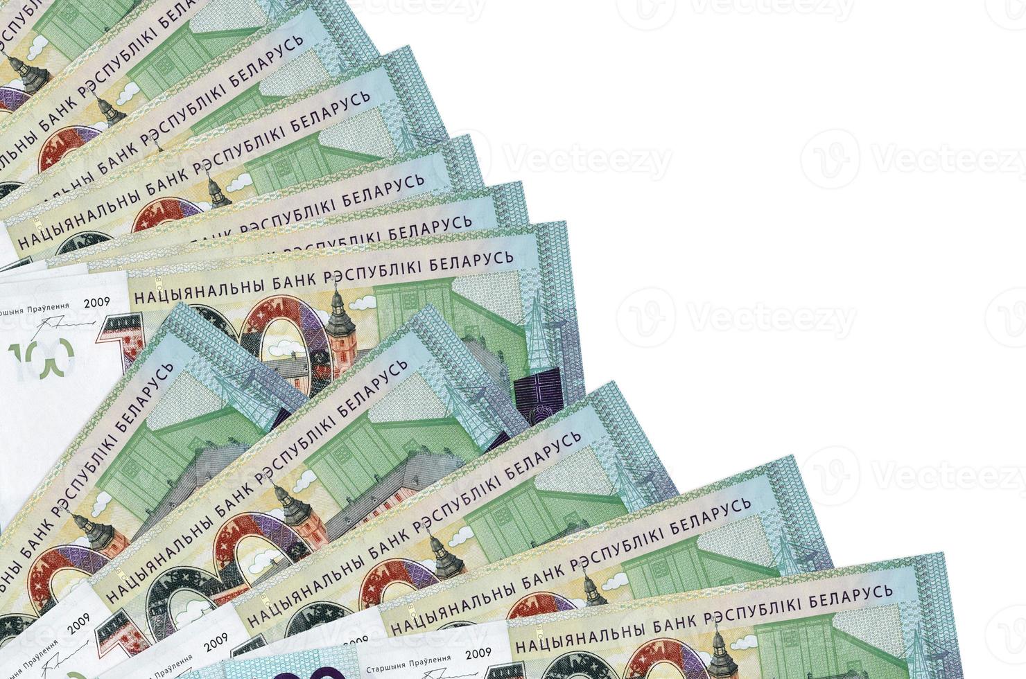 100 Belorussian rubles bills lies isolated on white background with copy space stacked in fan close up photo