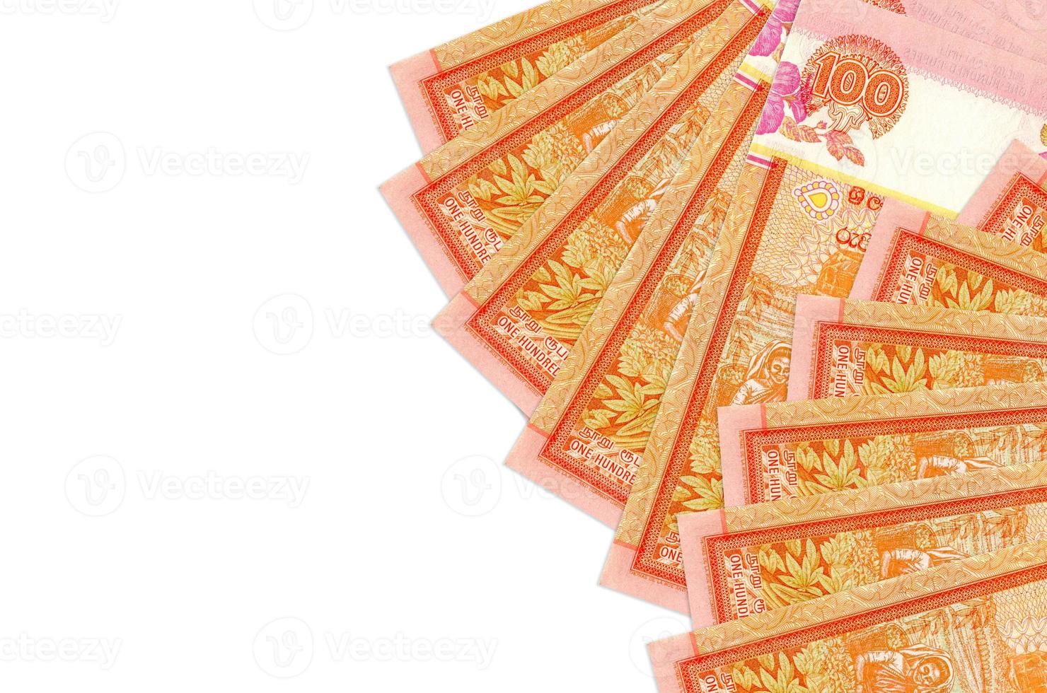 100 Sri Lankan rupees bills lies isolated on white background with copy space. Rich life conceptual background photo