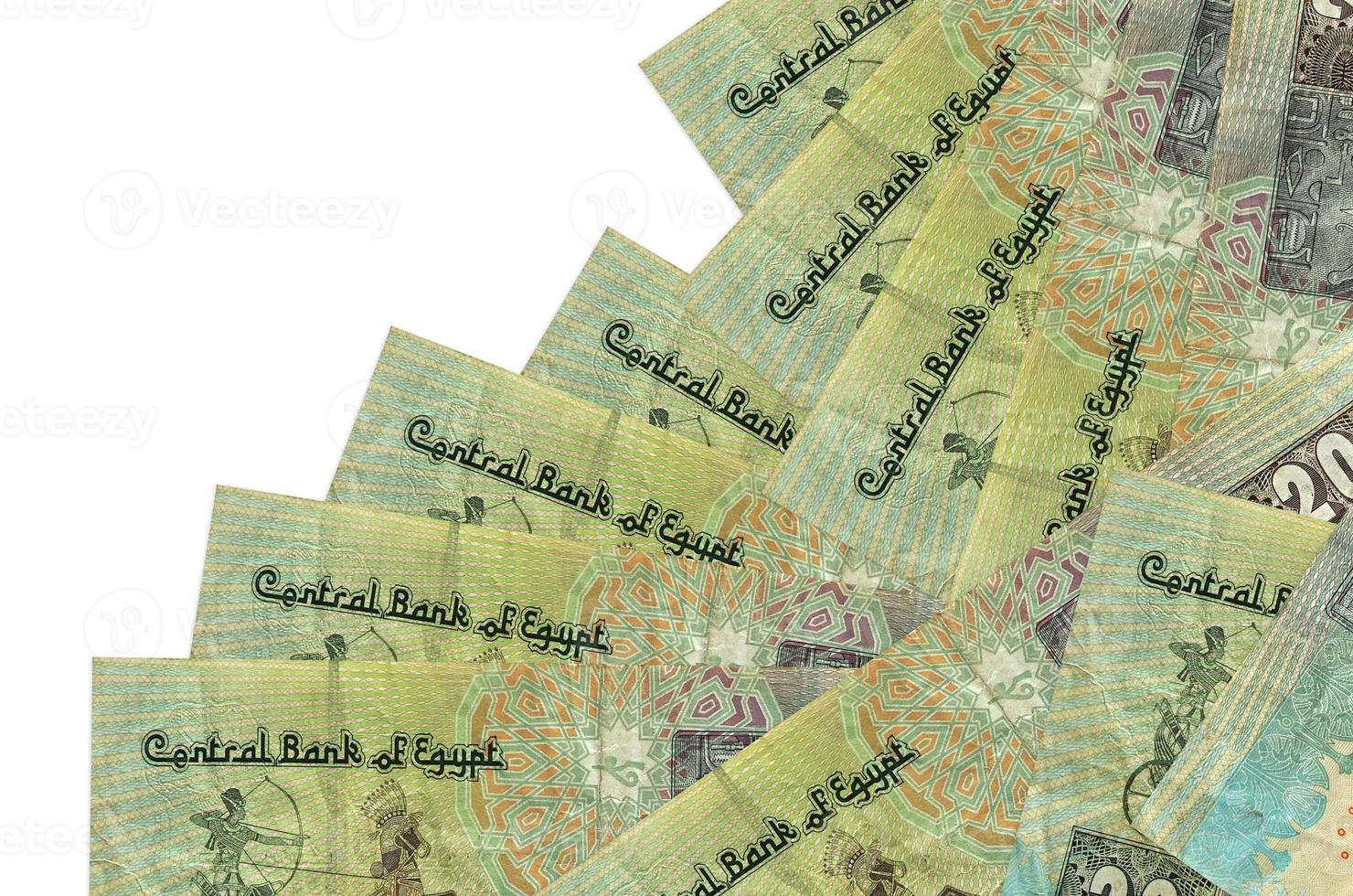 20 Egyptian pounds bills lies in different order isolated on white. Local banking or money making concept photo