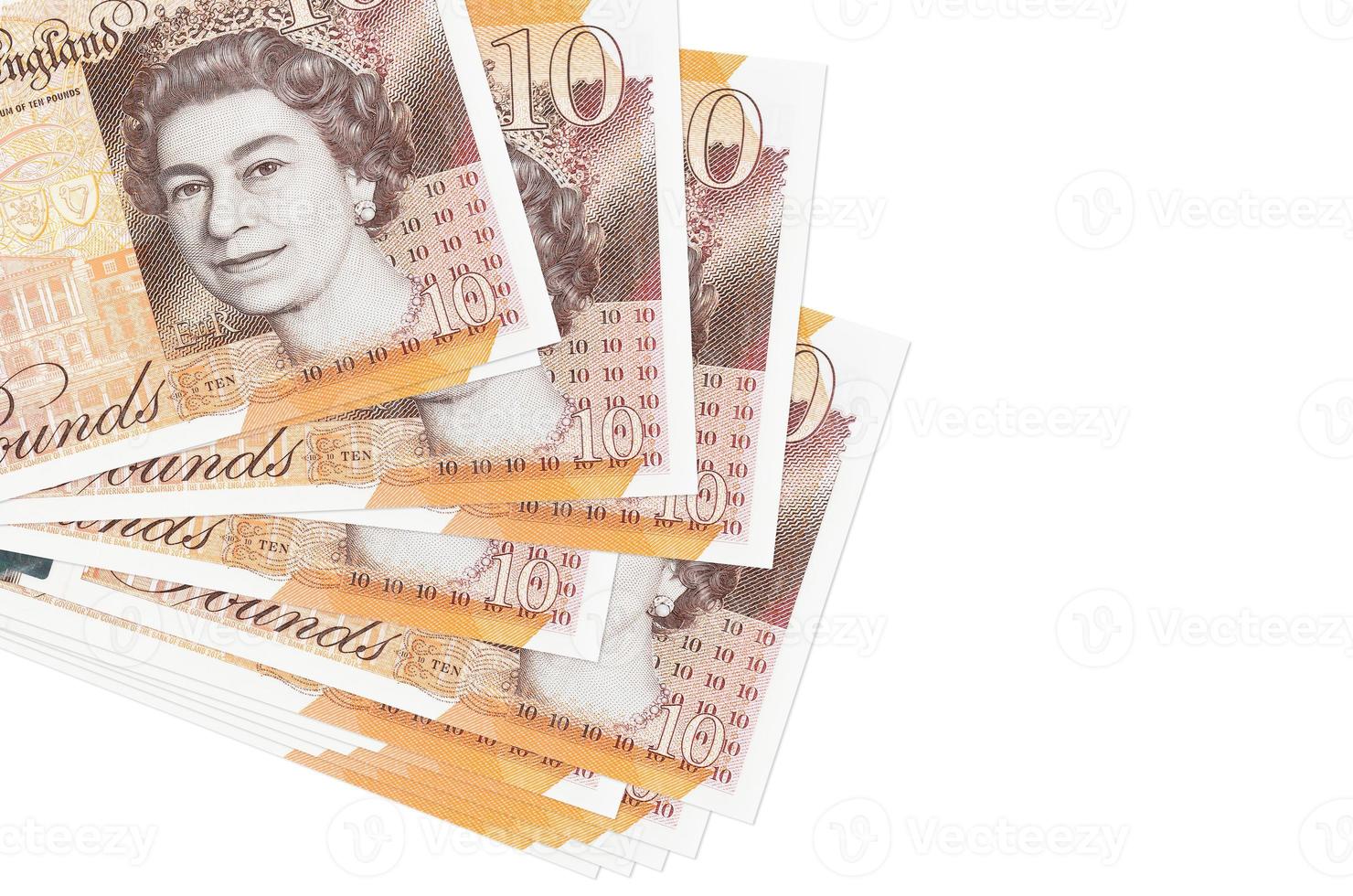 10 British pounds bills lies in small bunch or pack isolated on white. Mockup with copy space. Business and currency exchange photo