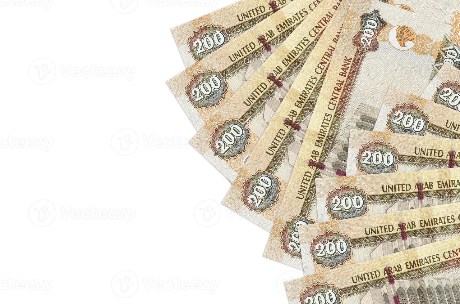 200 UAE dirhams bills lies isolated on white background with copy space. Rich life conceptual background photo