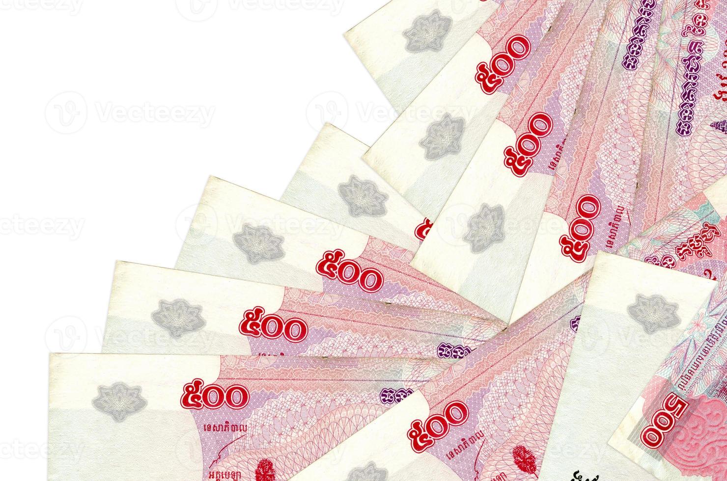 500 Cambodian riels bills lies in different order isolated on white. Local banking or money making concept photo