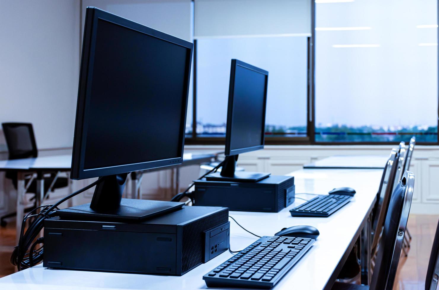 Computer and monitor row in computer class photo