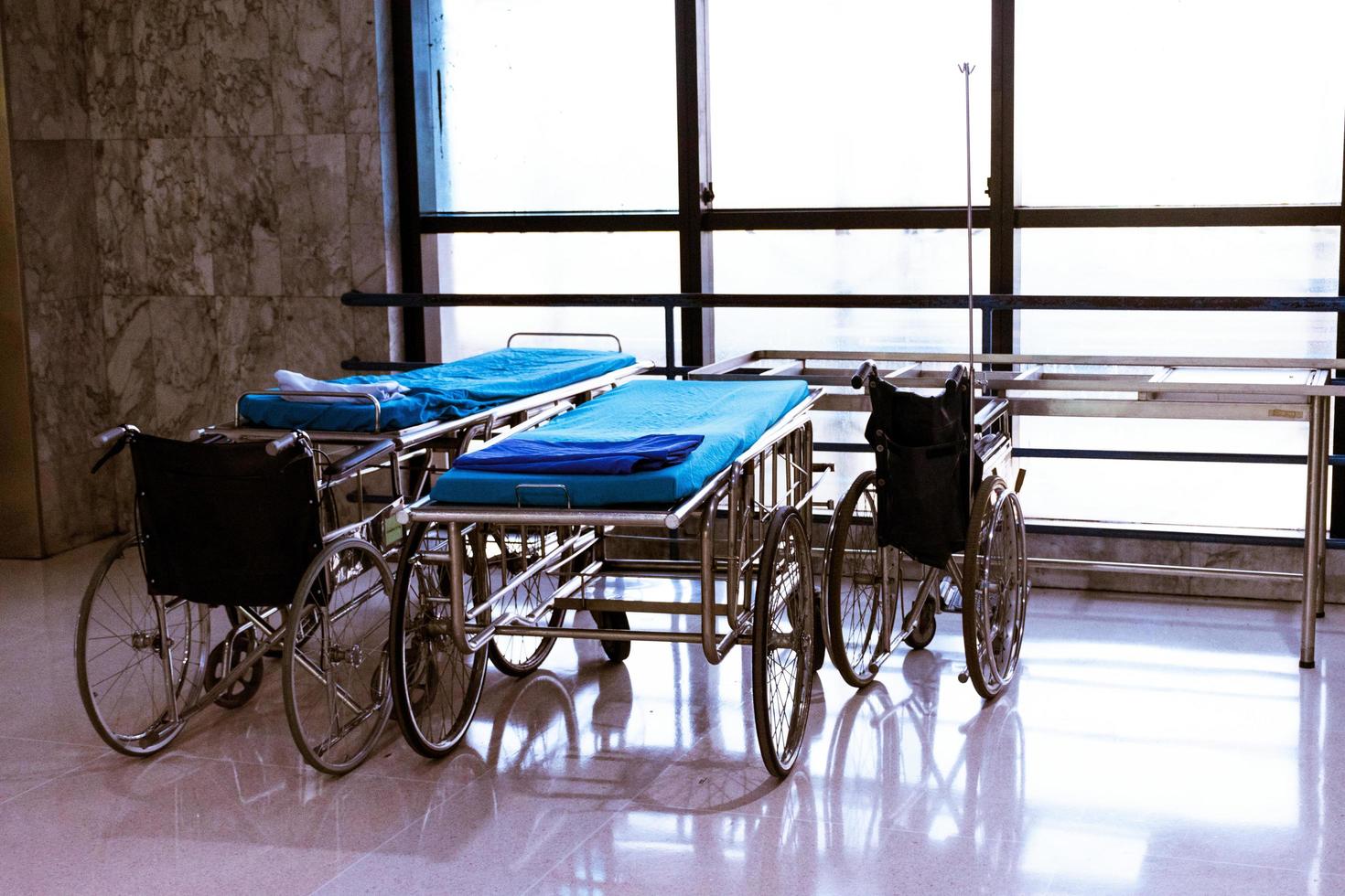 wheelchair and bed at hospital area photo