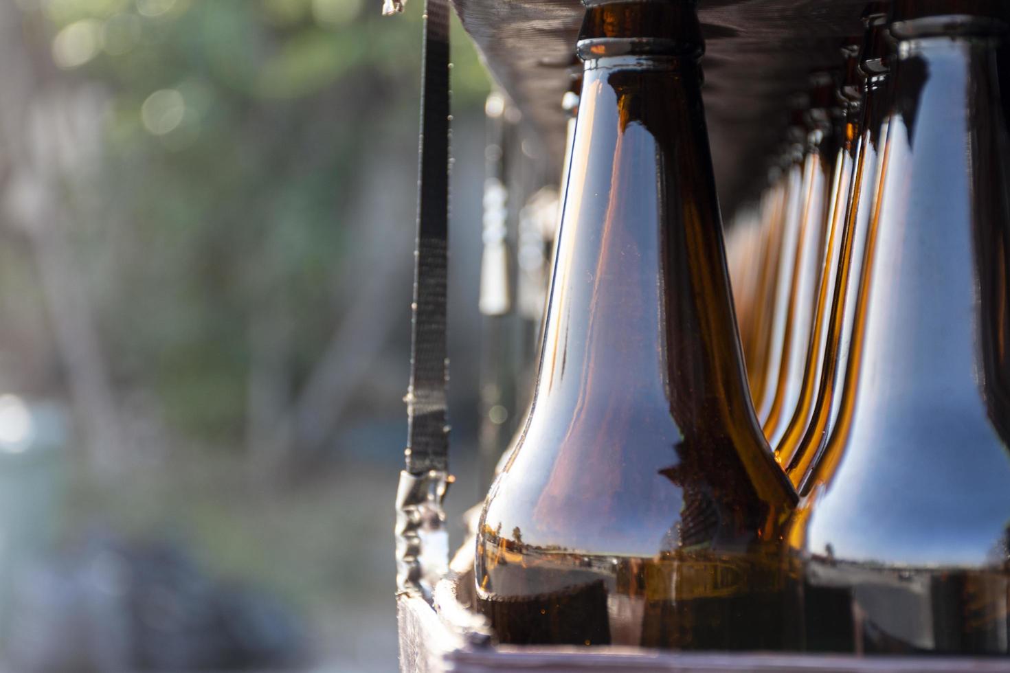 Close up beer bottle in pallet for brewing in industrial plants photo