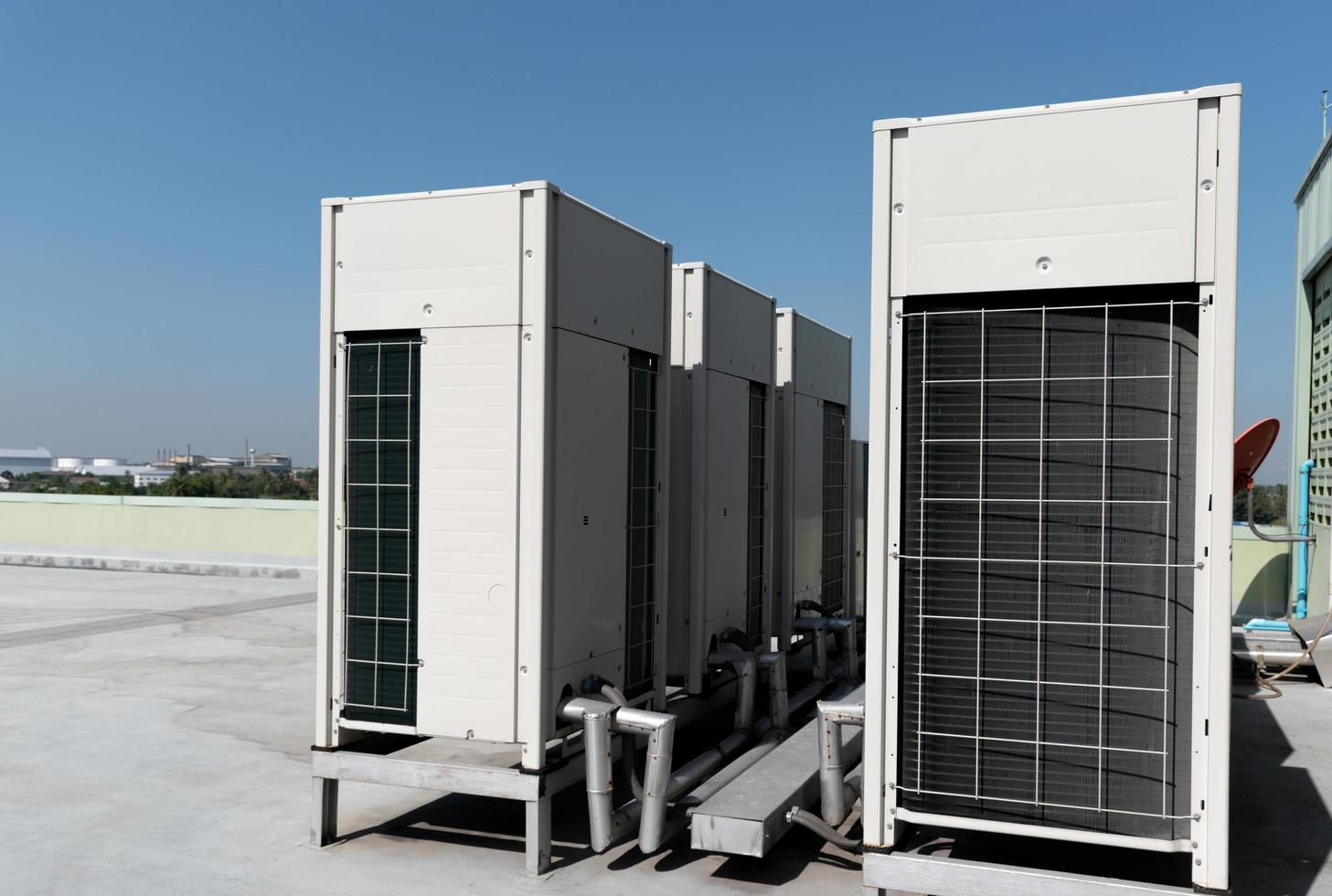 Compressors, air conditioners on the roof of the office building photo