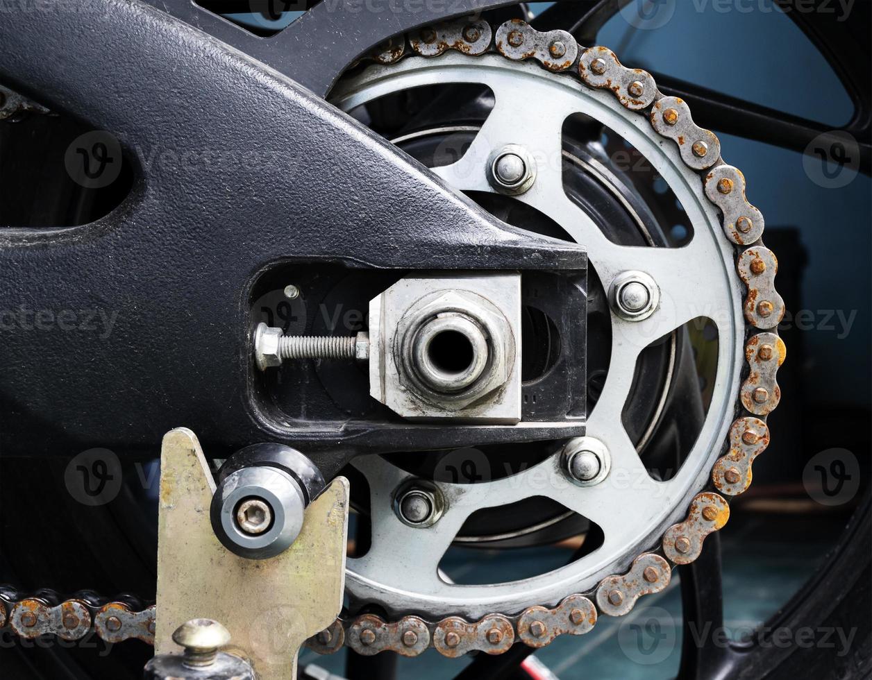 Motorcycle sprocket with rusty chain photo