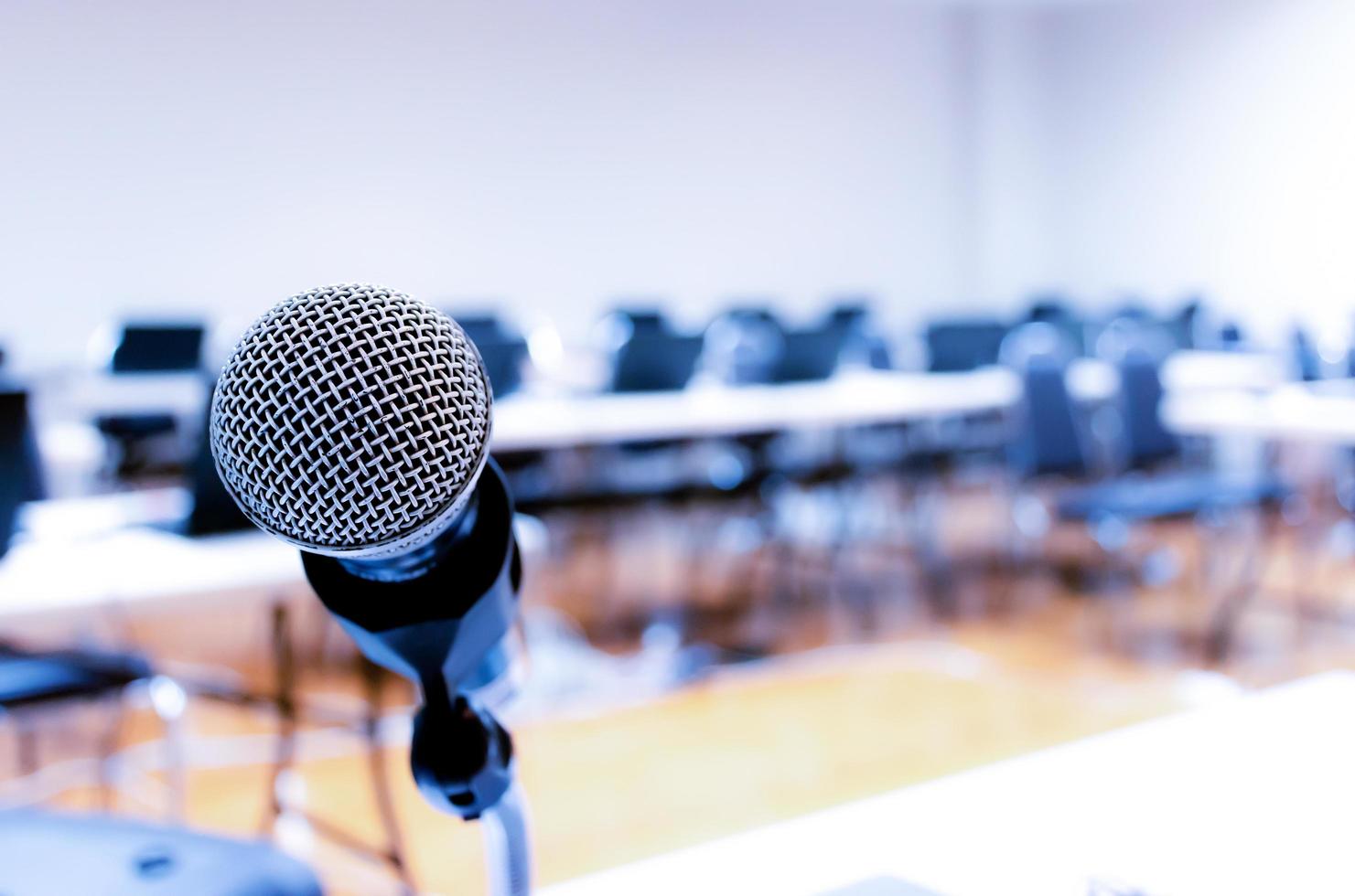 Microphone on stage of speech with copy space in computer classroom photo