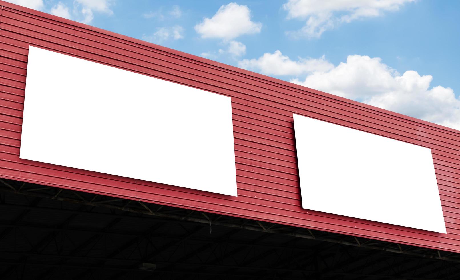 Mock up billboard on building with blue sky background photo