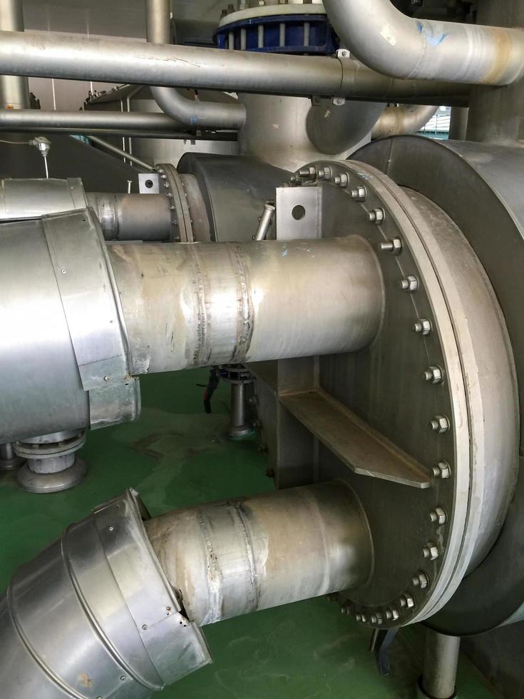 Stainless steel water pipe for delivering water to the production process. photo