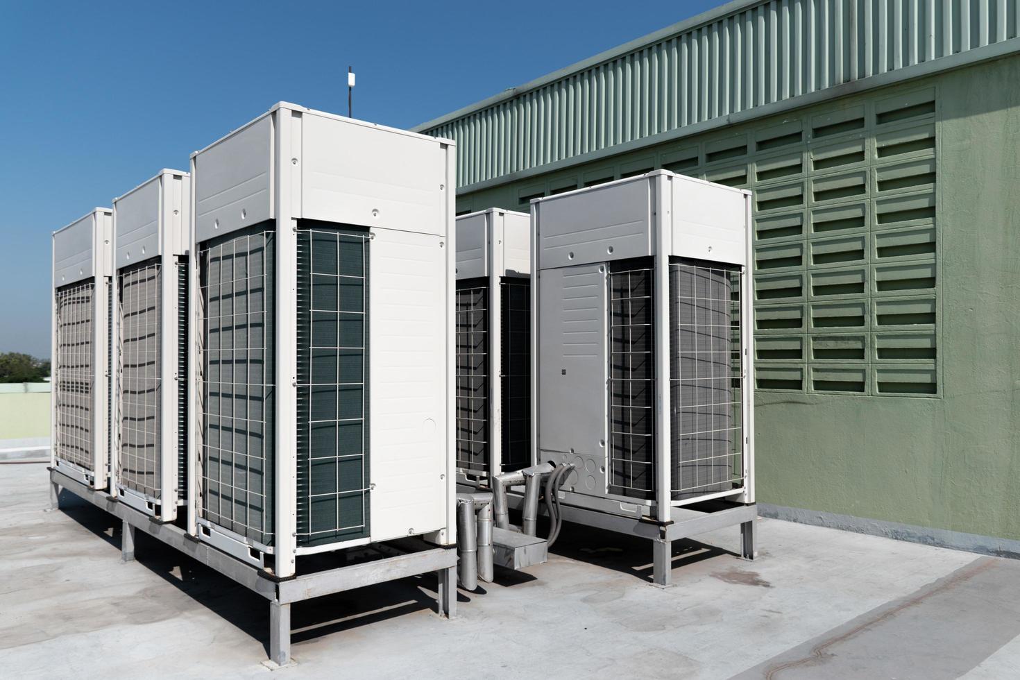 Compressors, air conditioners on the roof of the office building photo
