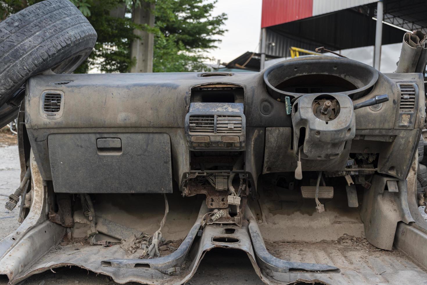 Old wrecked cars in junkyard photo