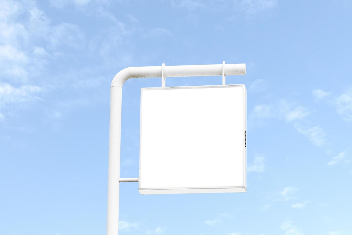 Outdoor billboard on blue sky background with white background mock up. clipping path photo