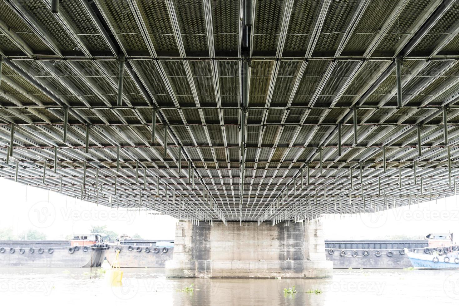 Steel frame scaffolding at the bridge renovation work on the river photo