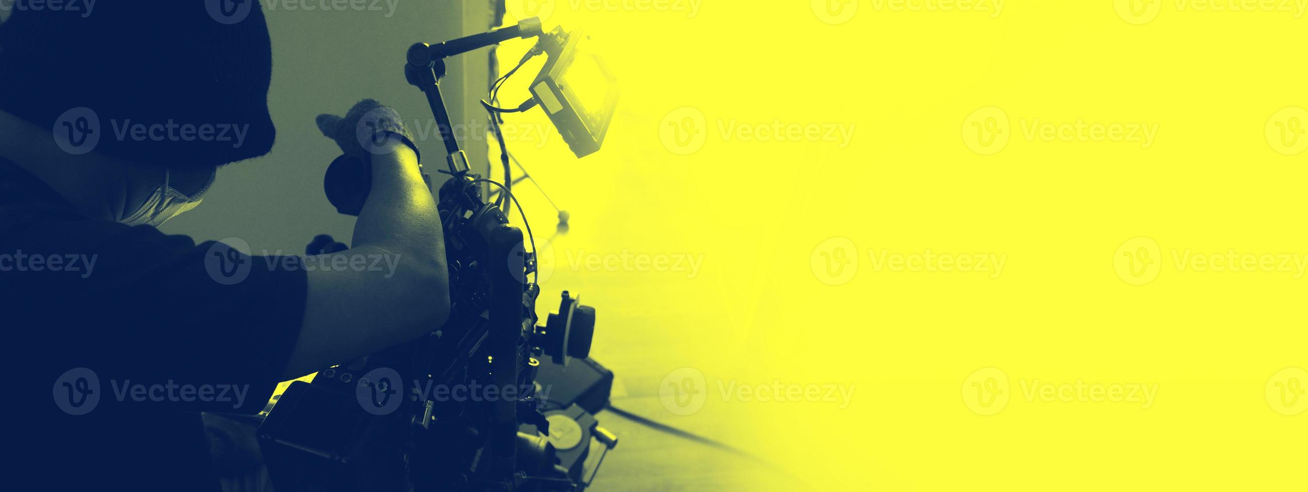 Behind the scenes of Videographer or photographer shooting video or movie production photo