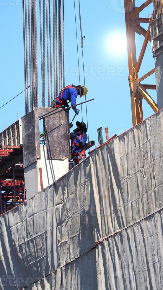 Two workers on the construction site. photo