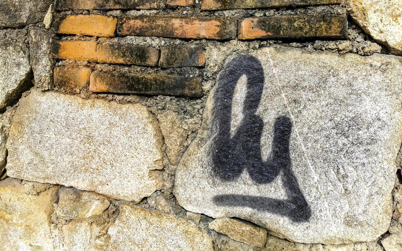 Rough stone and brick wall texture pattern Puerto Escondido Mexico. photo