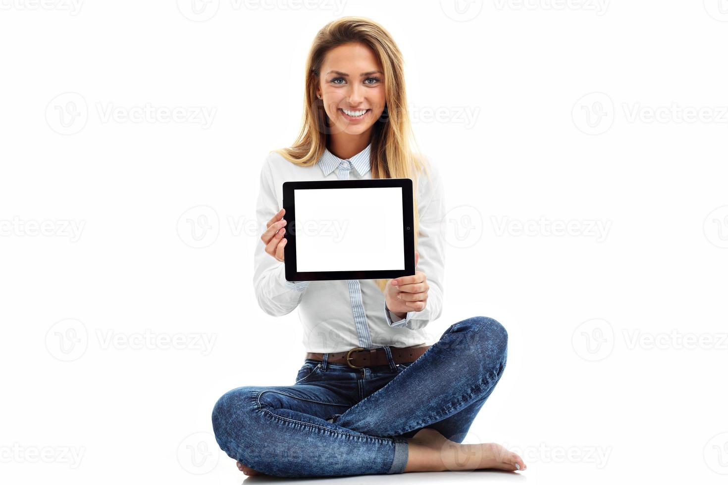 Woman using digital tablet computer PC isolated on white background photo