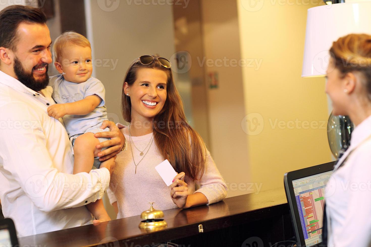 Family checking in hotel photo