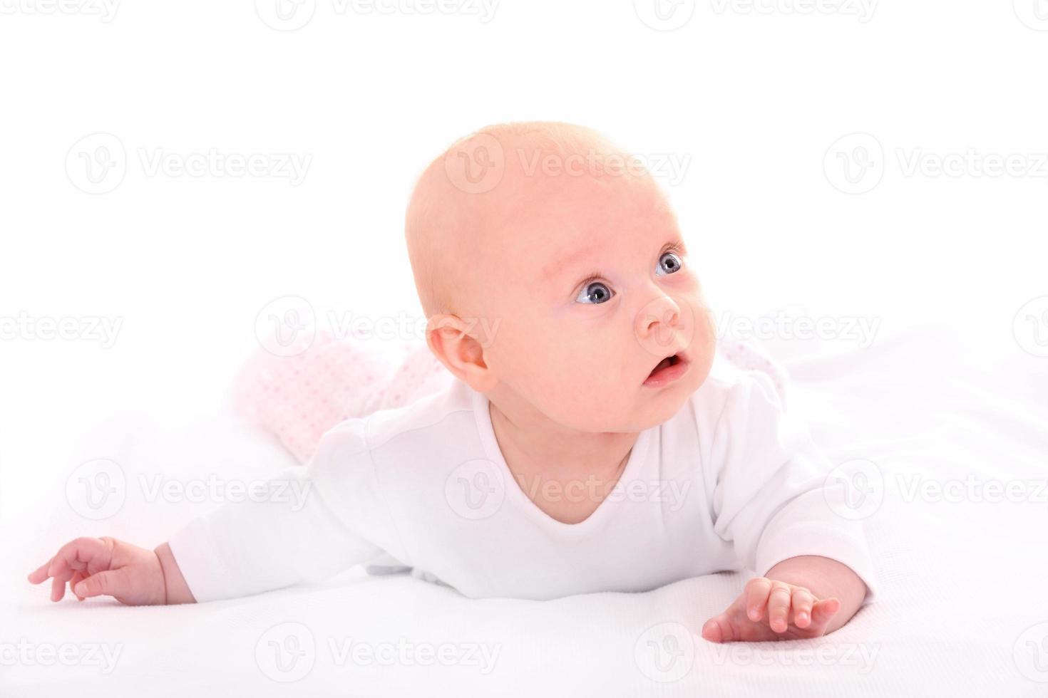 Curious baby on white background photo