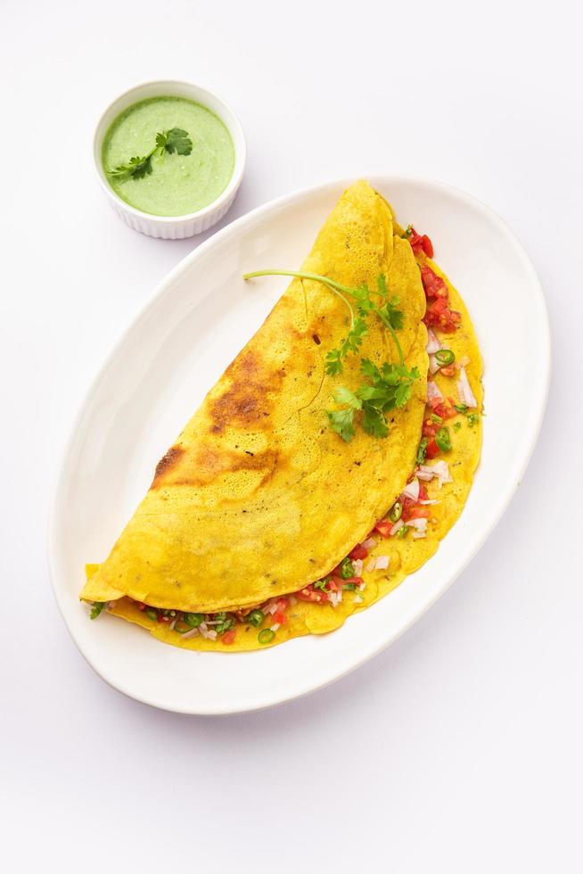 cheela, Chilla or Chila is a Rajasthani breakfast dish generally made with gram flour or besan photo