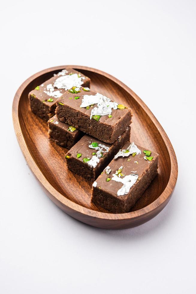 chocolate barfi or choco burfi cake, a tweak to indian dessert or sweet for festivals photo