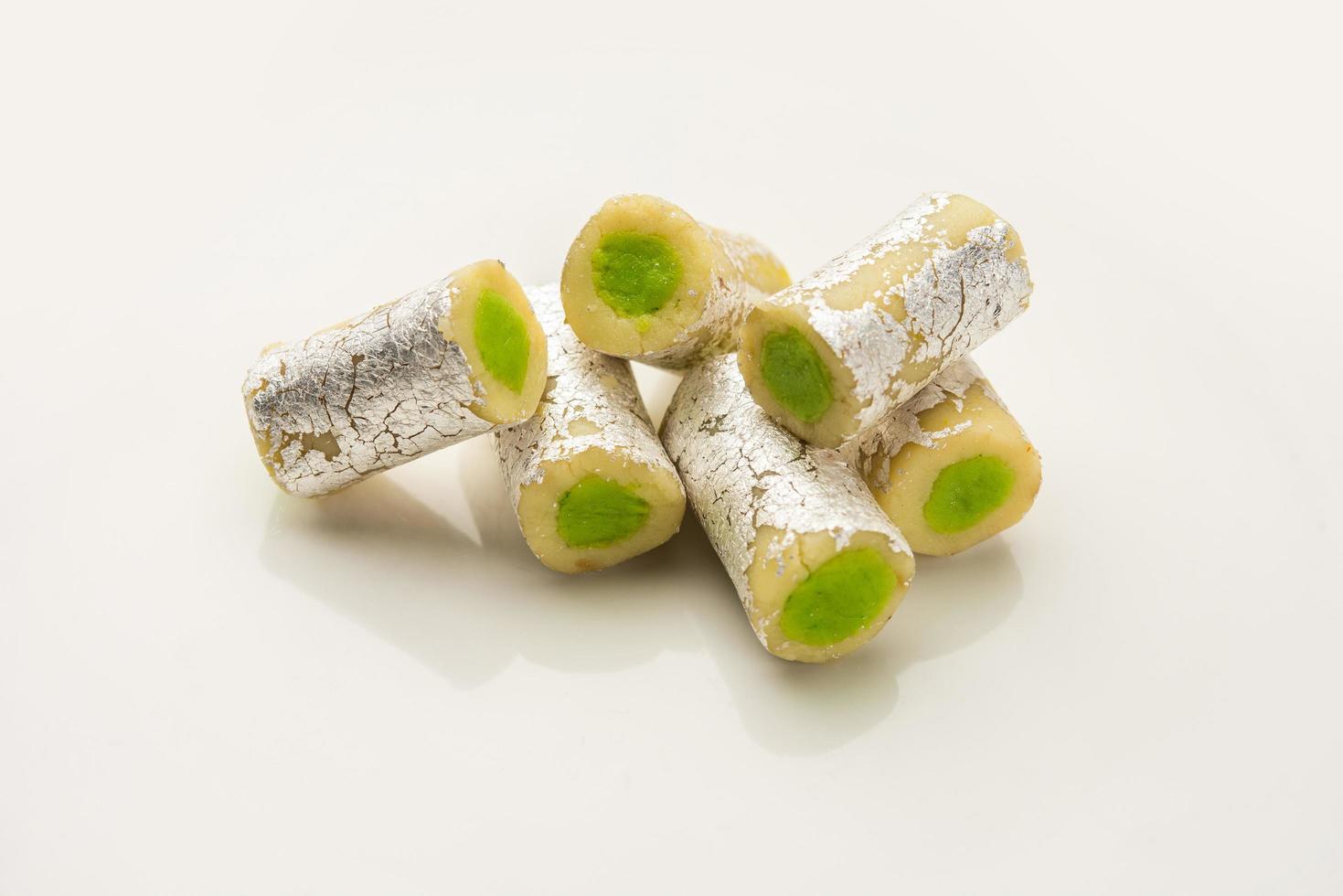 Kaju Pista Roll Or Cashew Pistachio Rolls Mithai or sigar, Indian sweet or dessert for festivals photo