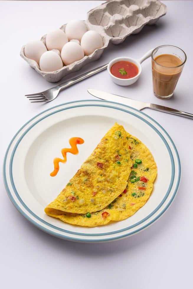 Indian Spiced Masala Omelet filled with fresh vegetable, healthy meal photo