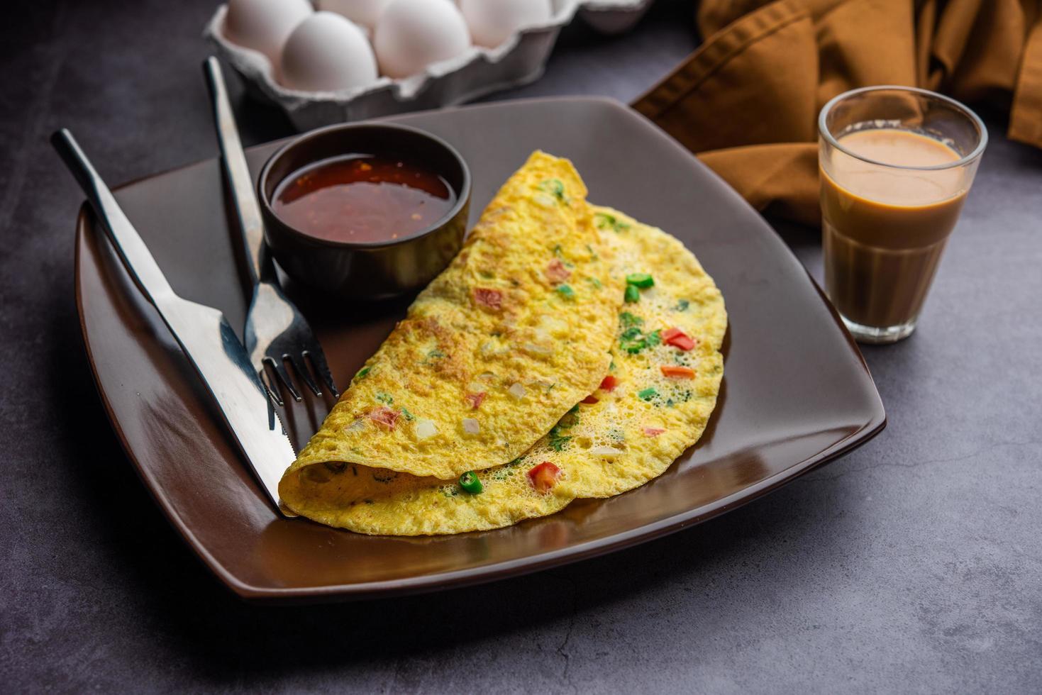 Indian Spiced Masala Omelet filled with fresh vegetable, healthy meal photo