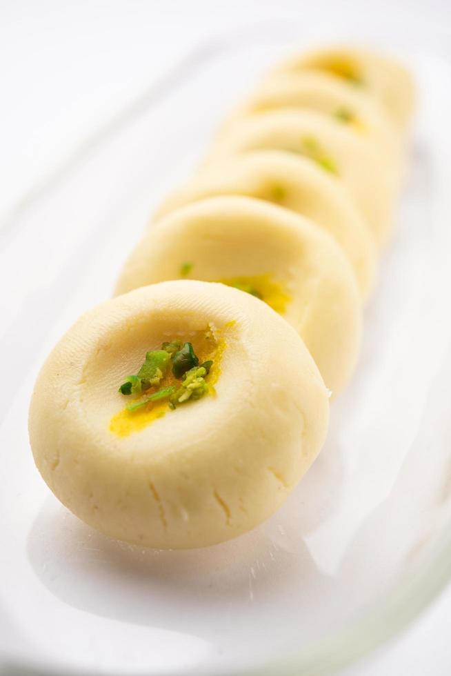 Sandesh or shondesh is a dessert, originating from the Bengal, India, created with milk and sugar photo