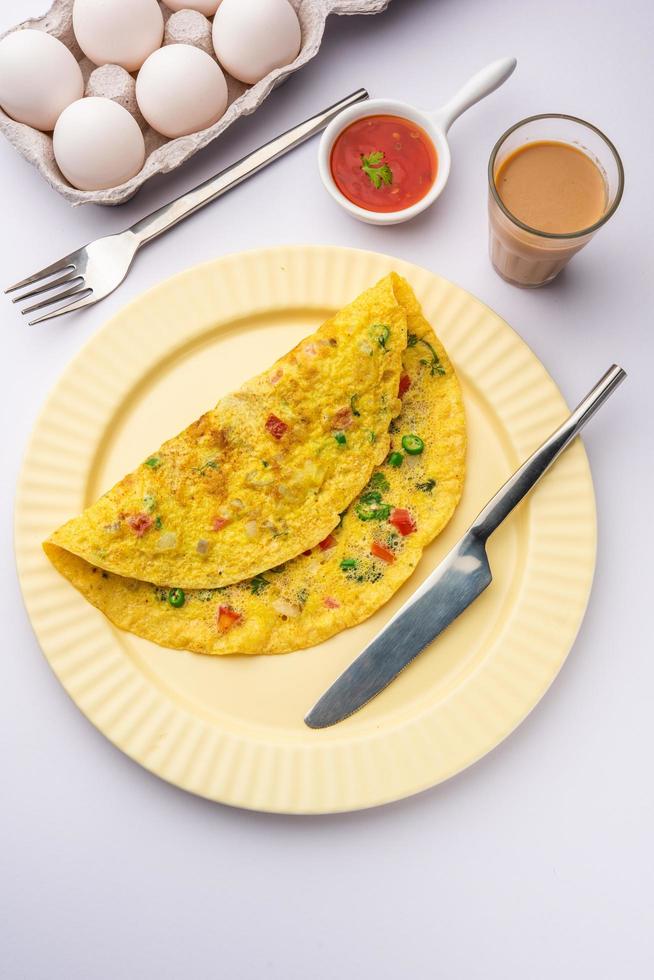 Indian Spiced Masala Omelet filled with fresh vegetable, healthy meal photo