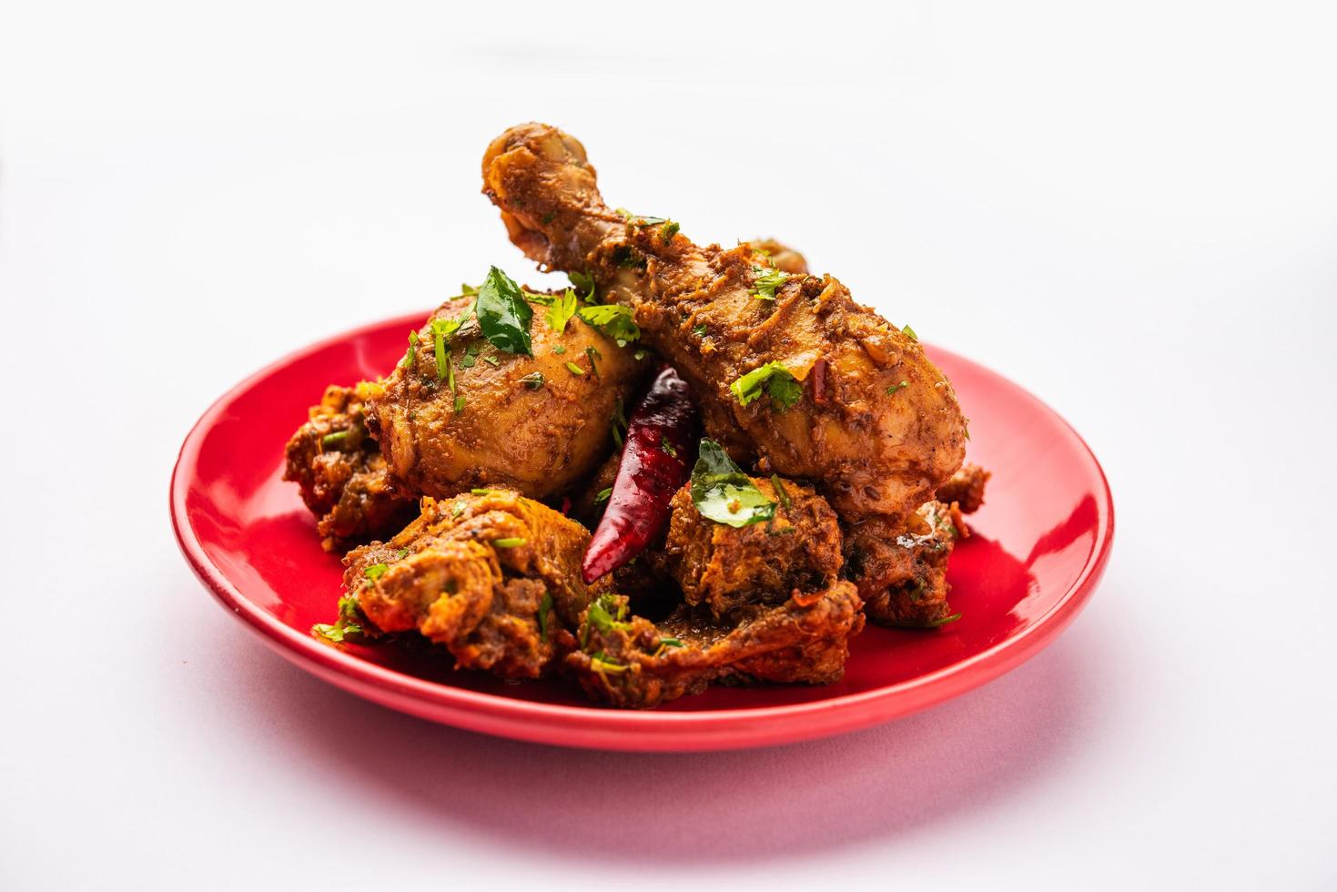 Sukha mutton or chicken, dry spicy Murgh or goat meat served in a plate or bowl photo