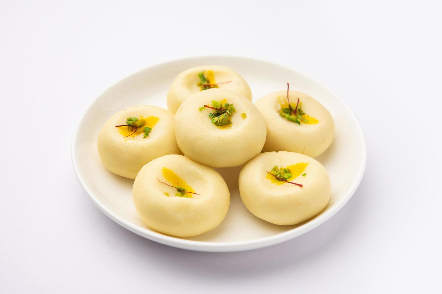 Sandesh or shondesh is a dessert, originating from the Bengal, India, created with milk and sugar photo