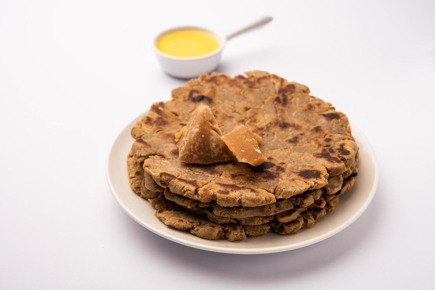 Sweet roti made out of rice flour, jaggery, and ghee. Gud ki roti. gur