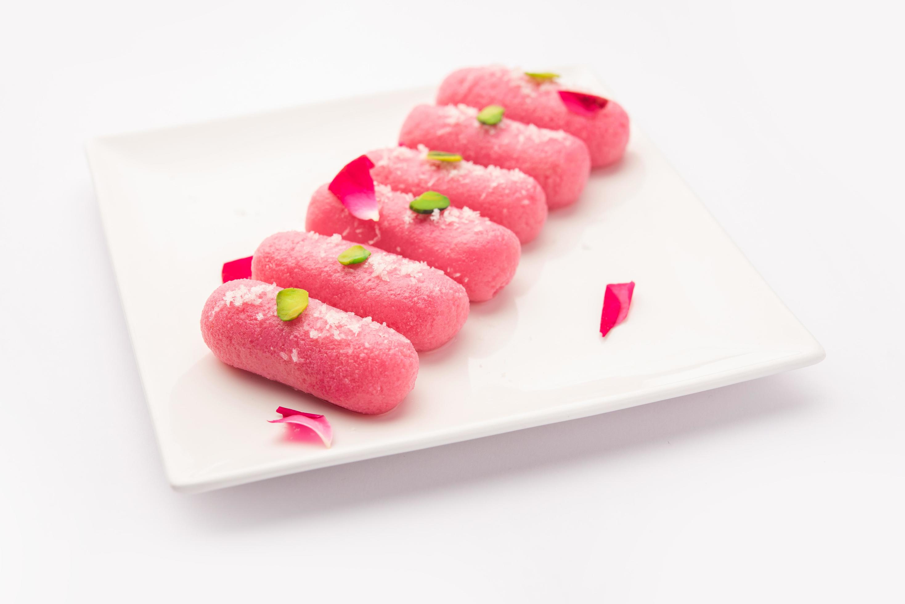 Pink Chumchum or rose flavoured chum chum or cham cham, indian and